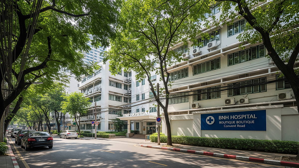 The tree-lined entrance to BNH Hospital, a trusted medical provider for expats in the Silom-Sathorn CBD of Bangkok
