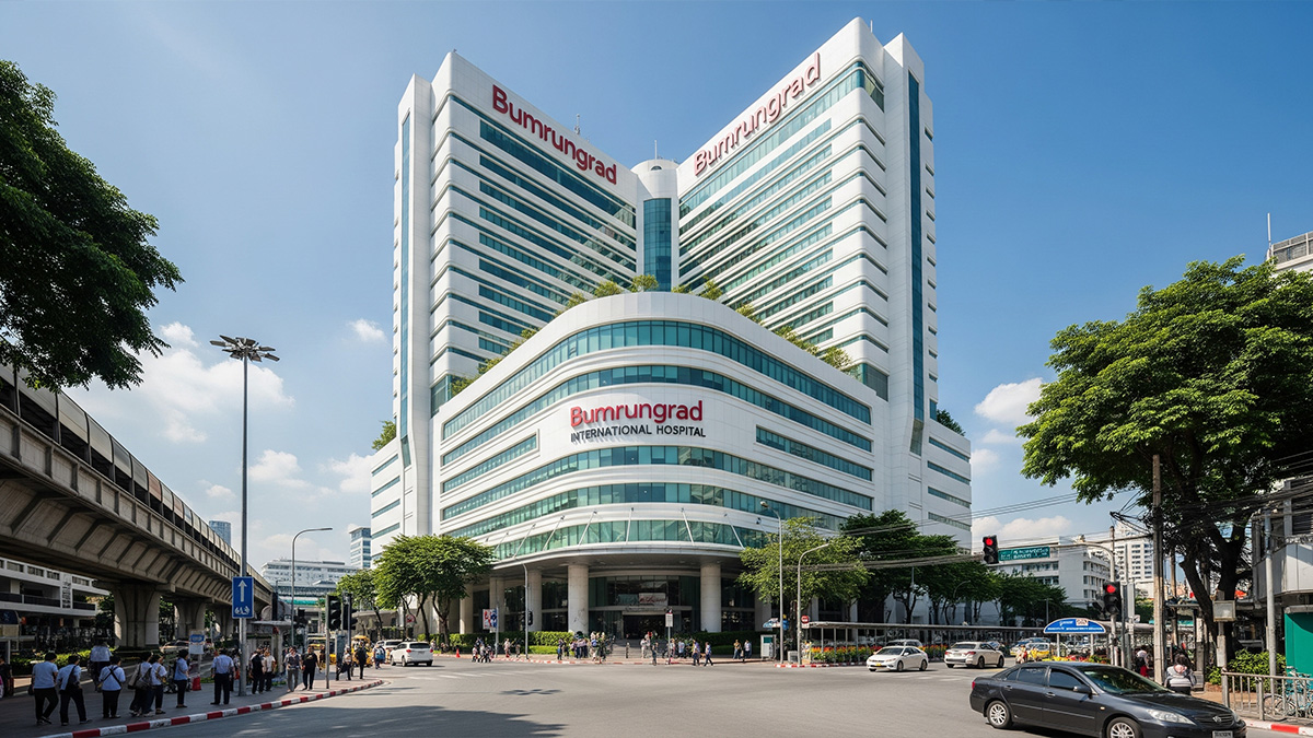 The modern exterior of Bumrungrad International Hospital, one of the best hospitals in Bangkok, located in the bustling Sukhumvit area.